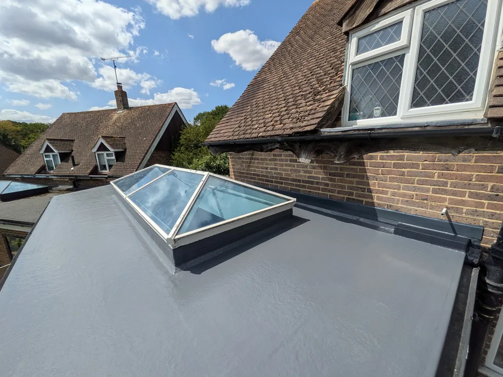 Seamless GRP fibreglass overlay on a Godstone flat roof with rooflight